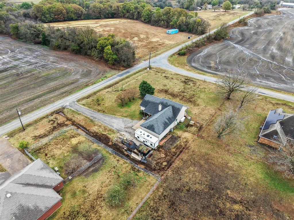 293 Redden Road Van Alstyne, TX 75495 - Photo 39 of 40 a view of a backyard with wooden floor