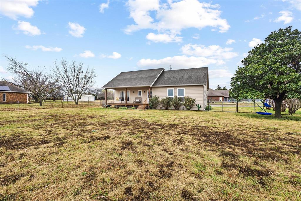 293 Redden Road Van Alstyne, TX 75495 - Photo 4 of 40 a front view of a house with a yard