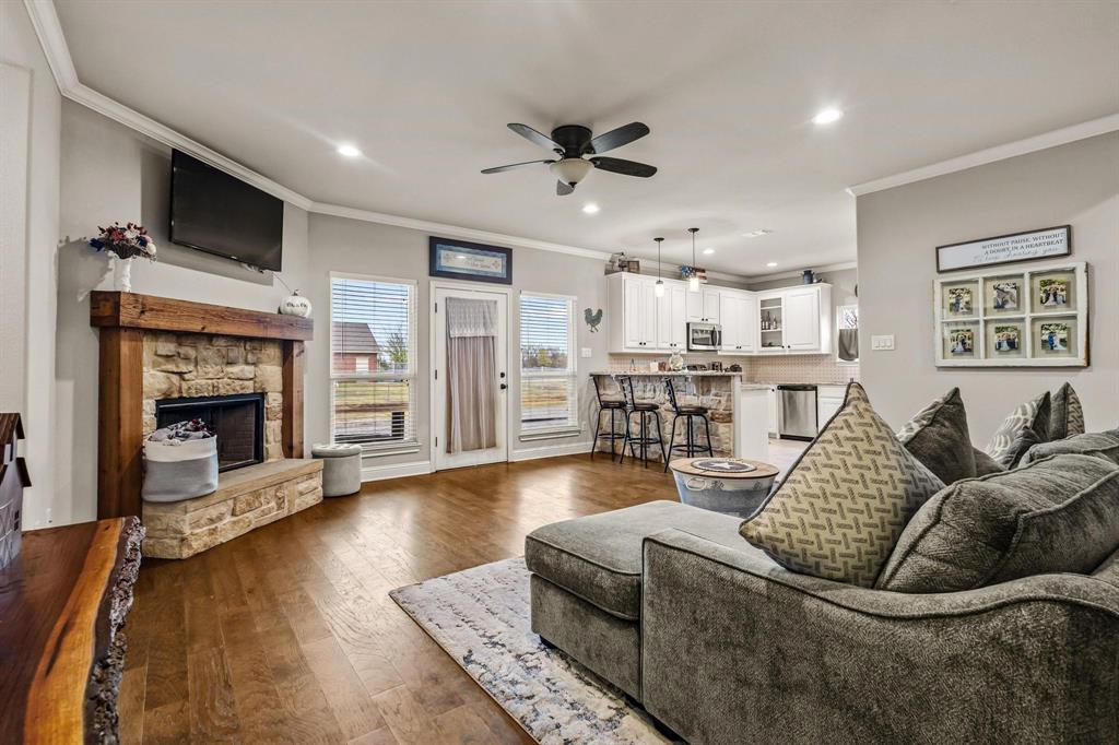293 Redden Road Van Alstyne, TX 75495 - Photo 7 of 40 a living room with furniture fireplace and flat screen tv