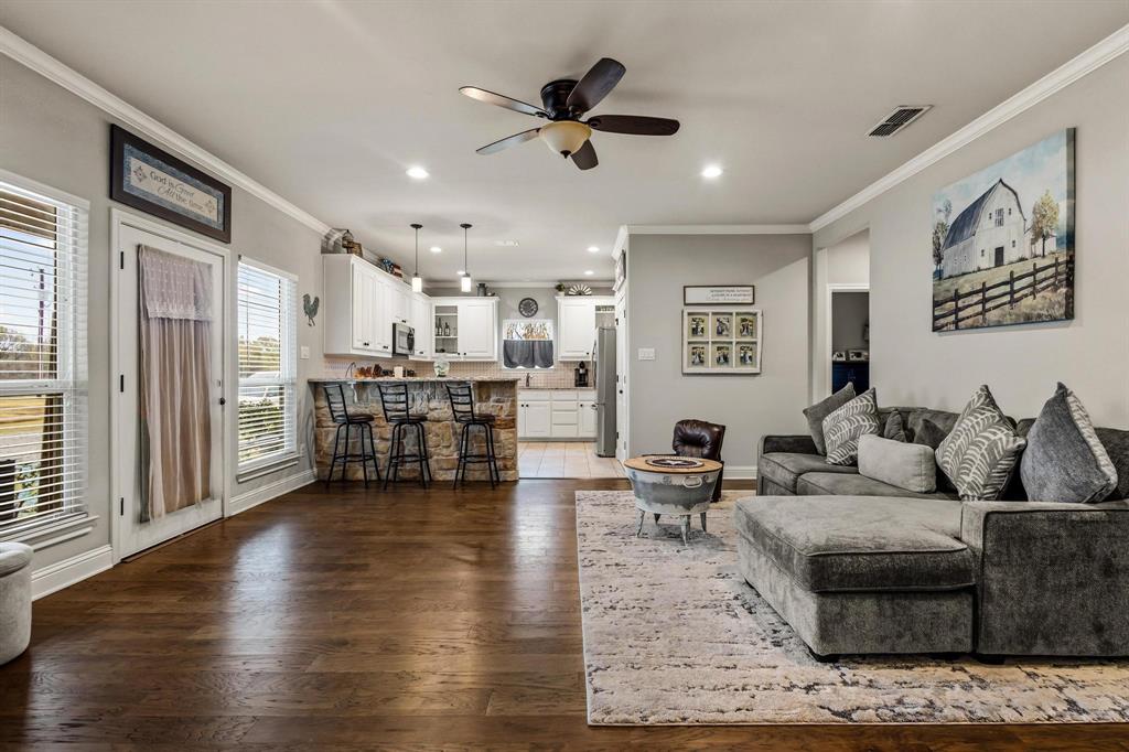 293 Redden Road Van Alstyne, TX 75495 - Photo 8 of 40 a living room with furniture and kitchen view