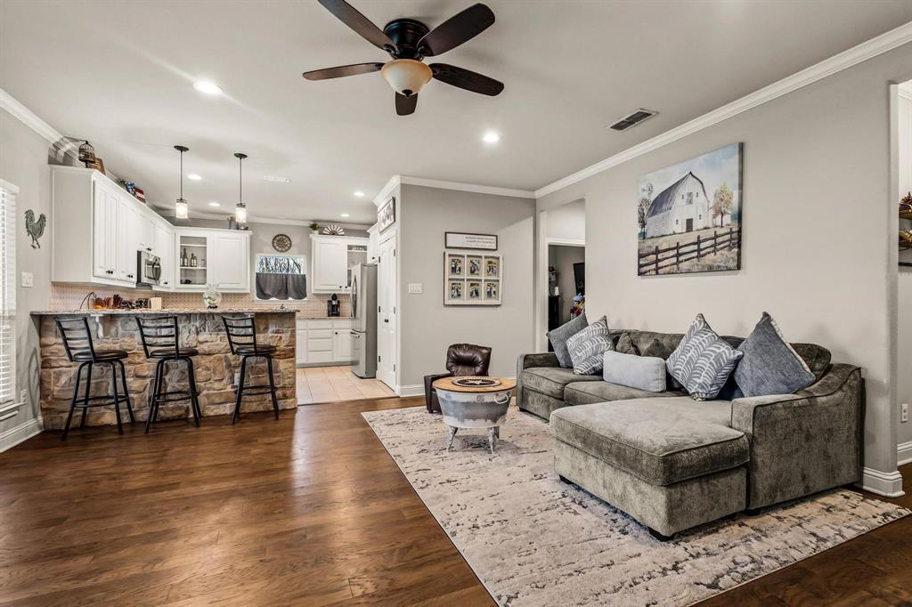 293 Redden Road Van Alstyne, TX 75495 - Photo 9 of 40 a living room with furniture and kitchen view