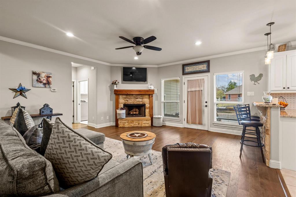 293 Redden Road Van Alstyne, TX 75495 - Photo 10 of 40 a living room with furniture and a fireplace