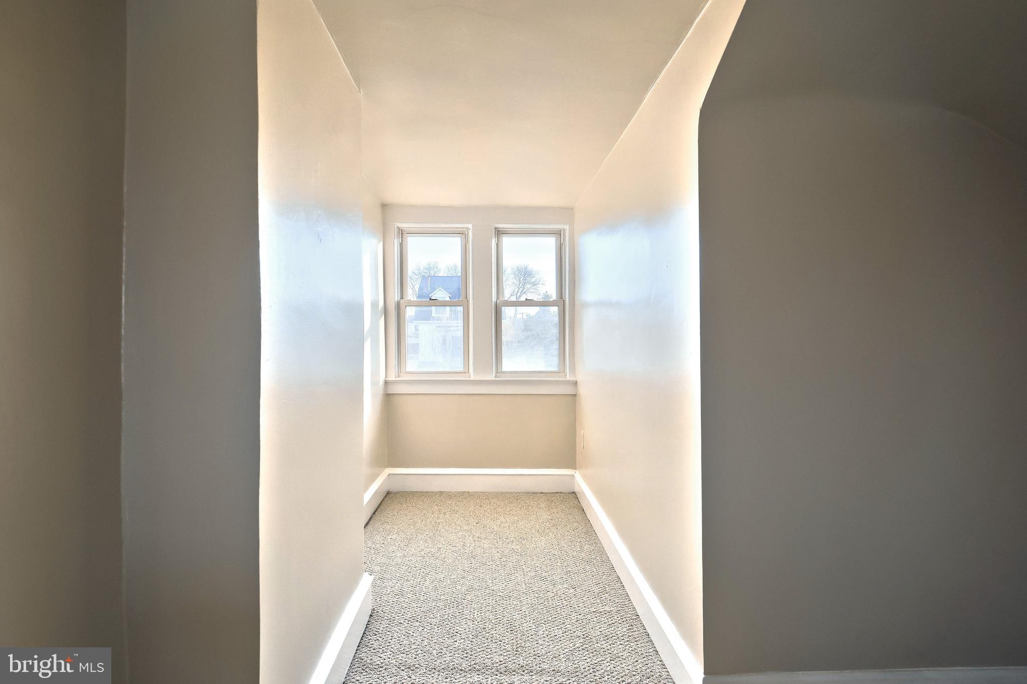 1501 3rd Avenue York, PA 17403 - Photo 35 of 40 a view of an empty room with wooden floor and a window