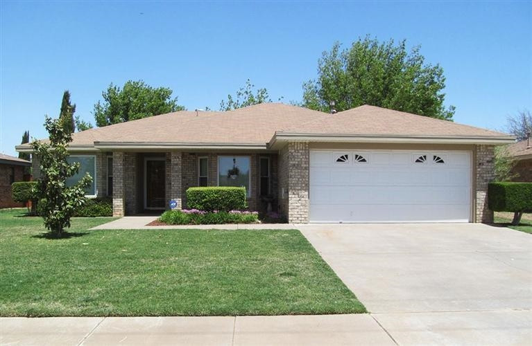 6018 73rd Street Lubbock, TX 79424 - Photo 1 of 10 a front view of a house with a yard