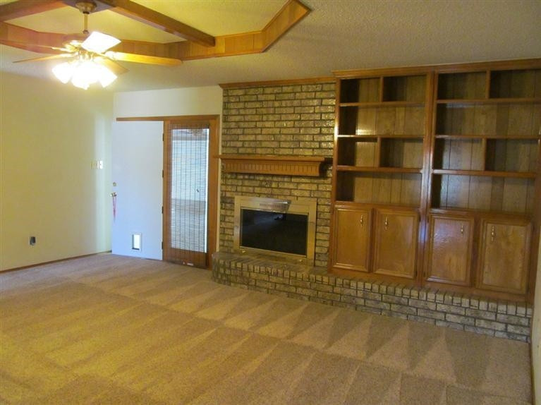 6018 73rd Street Lubbock, TX 79424 - Photo 3 of 10 a view of a fireplace with a door