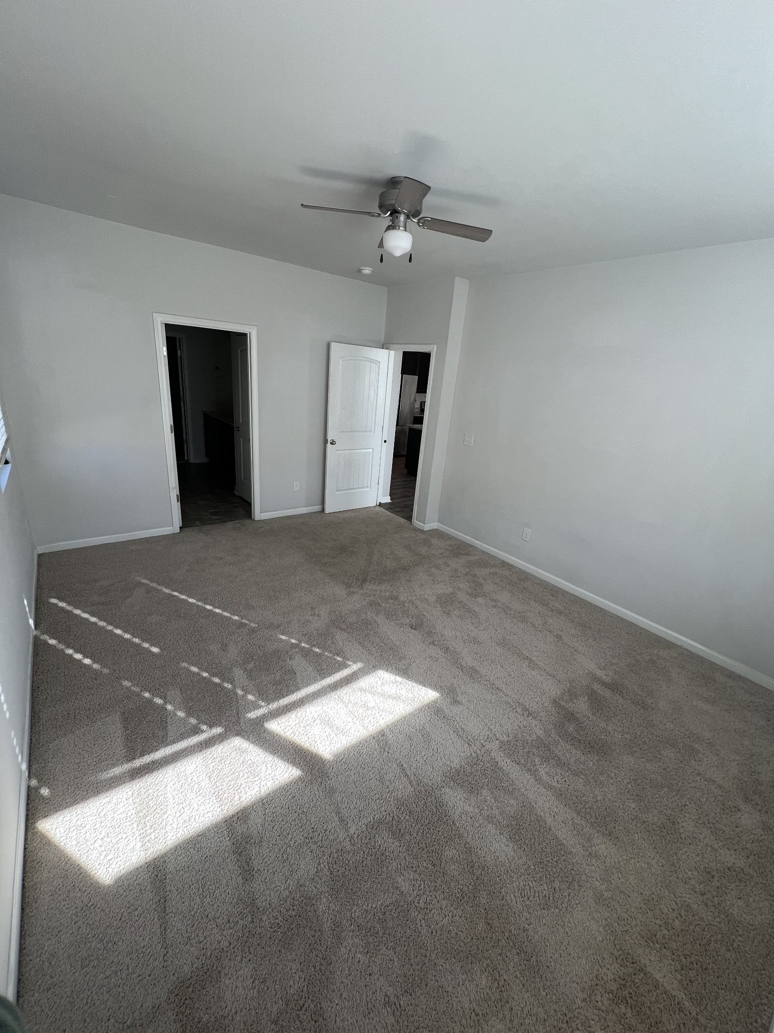 231 Tessa Grace Way Murfreesboro, TN 37129 - Photo 12 of 34 a view of a hallway with a chandelier fan