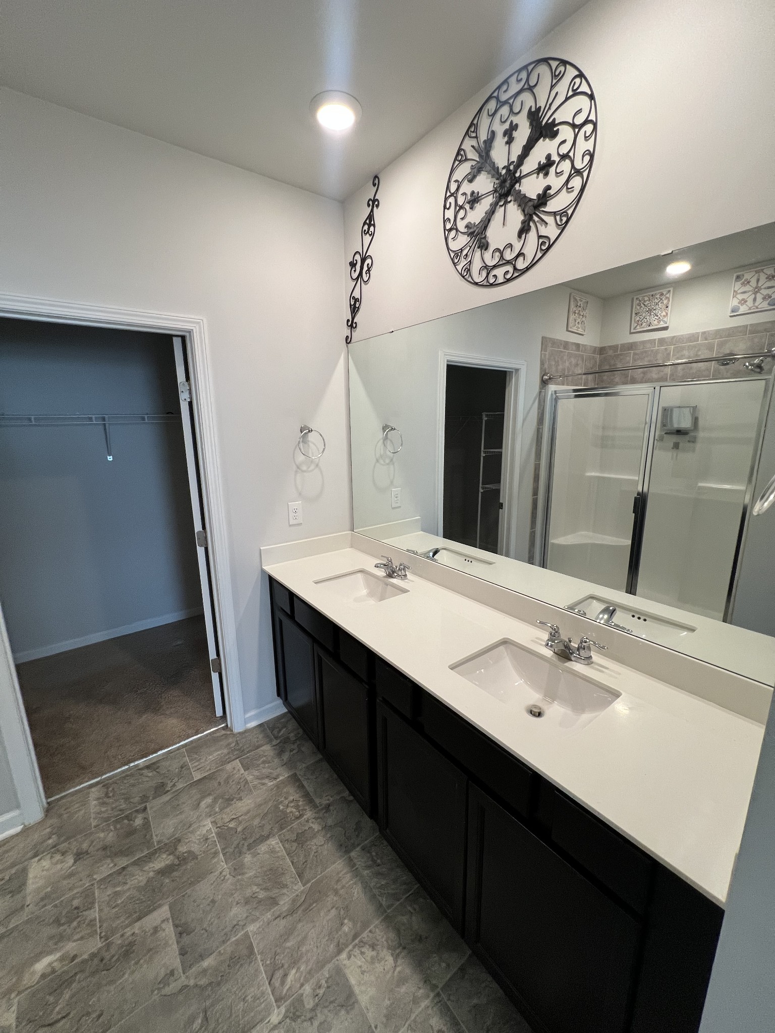 231 Tessa Grace Way Murfreesboro, TN 37129 - Photo 15 of 34 a spacious bathroom with a double vanity sink and a mirror