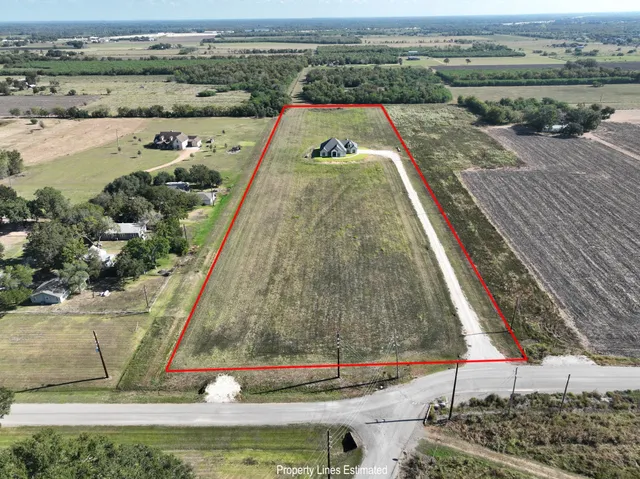 a view of a swimming pool with a yard