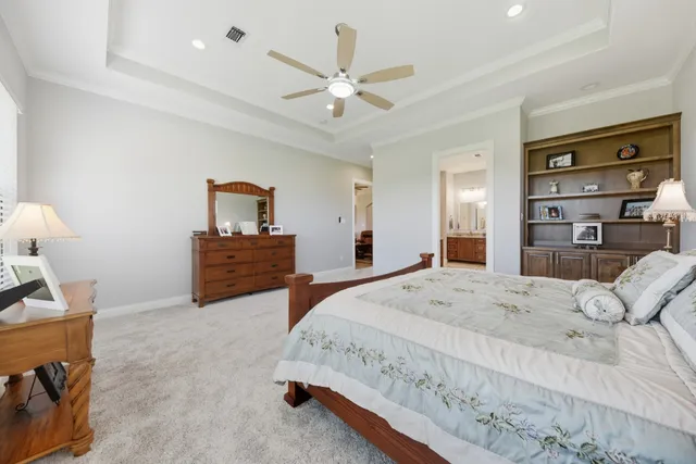 a bathroom with a double vanity sink mirror and shower