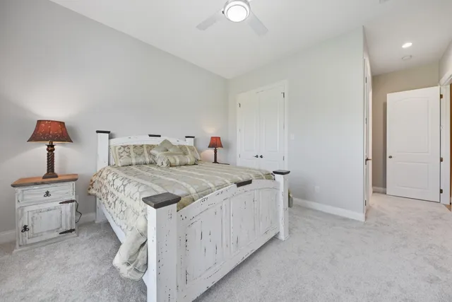 a bedroom with a bed and a dresser