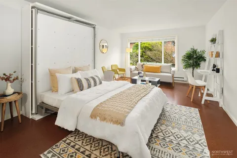 a bed room with a bed and a couch