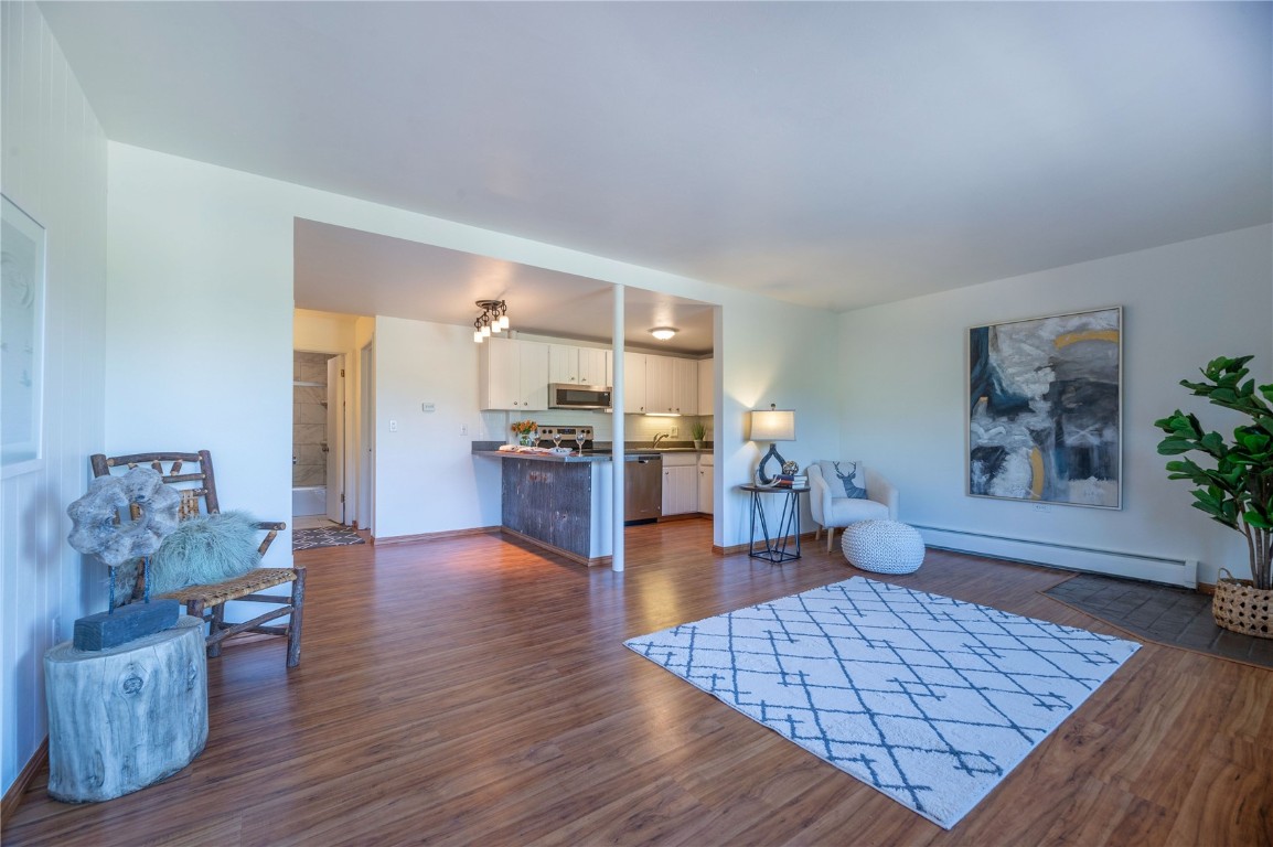 110 Evergreen Road, Unit 102 Dillon, CO 80435 - Photo 1 of 30 a living room with furniture and wooden floor