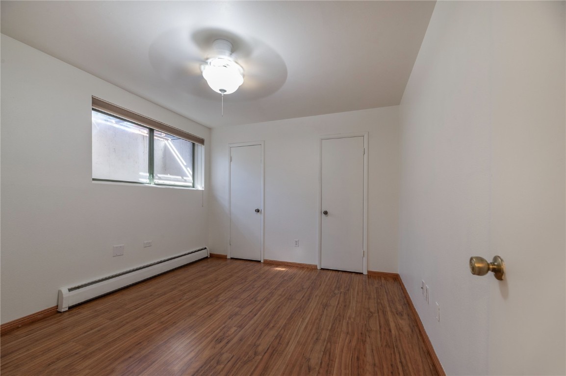 110 Evergreen Road, Unit 102 Dillon, CO 80435 - Photo 12 of 30 wooden floor in an empty room with a window