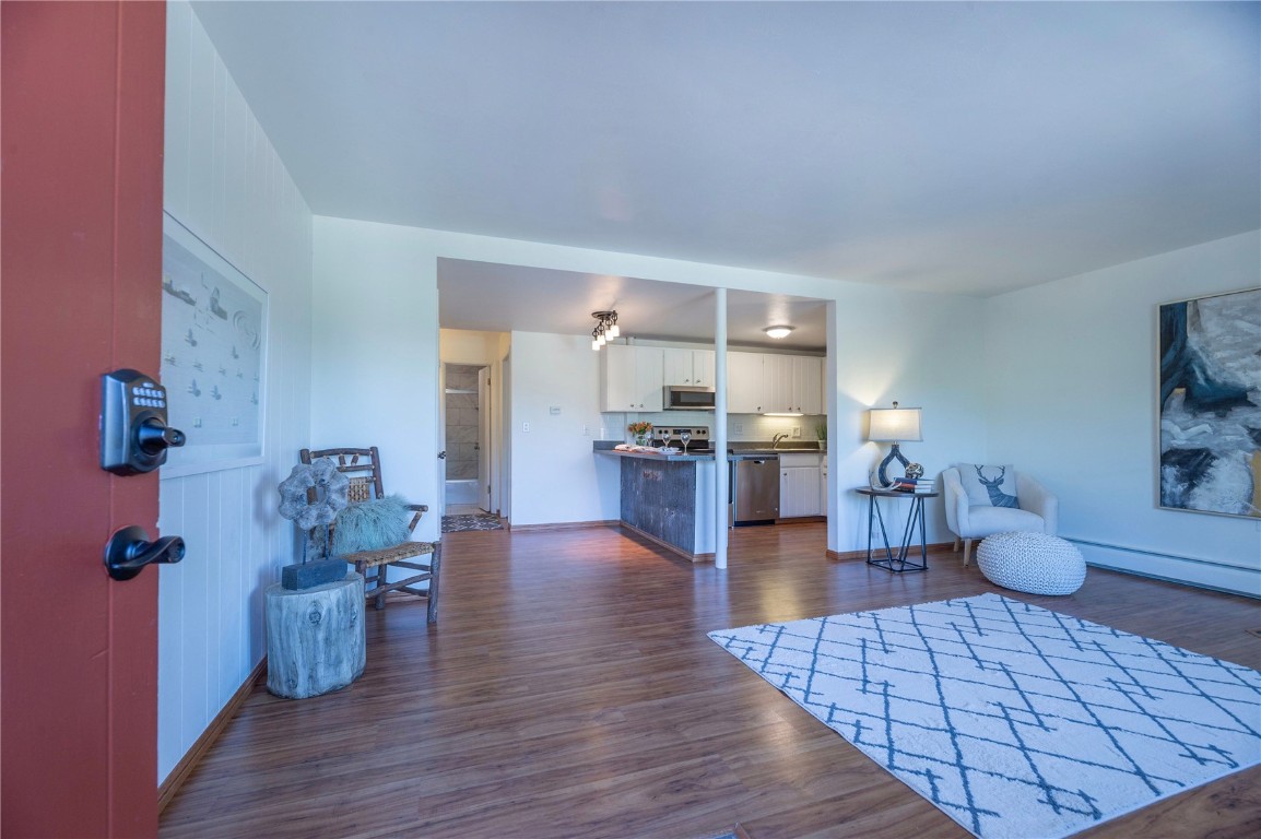 110 Evergreen Road, Unit 102 Dillon, CO 80435 - Photo 20 of 30 a living room with furniture and wooden floor
