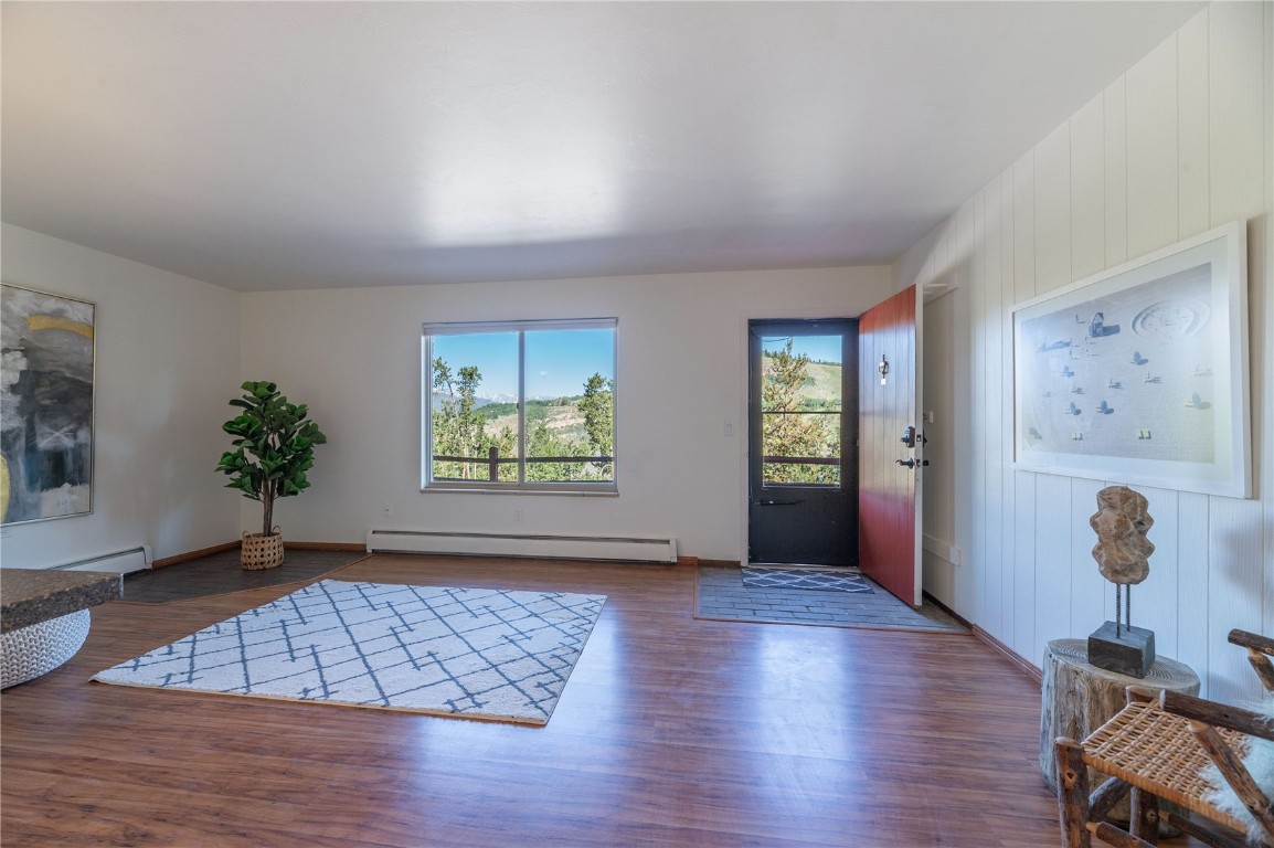 110 Evergreen Road, Unit 102 Dillon, CO 80435 - Photo 24 of 30 a view of empty room with wooden floor and fan