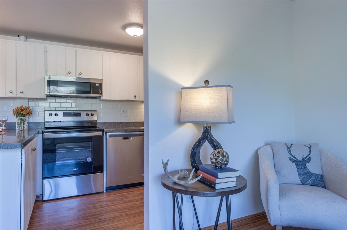 110 Evergreen Road, Unit 102 Dillon, CO 80435 - Photo 27 of 30 a kitchen with stainless steel appliances granite countertop a stove a sink and a refrigerator