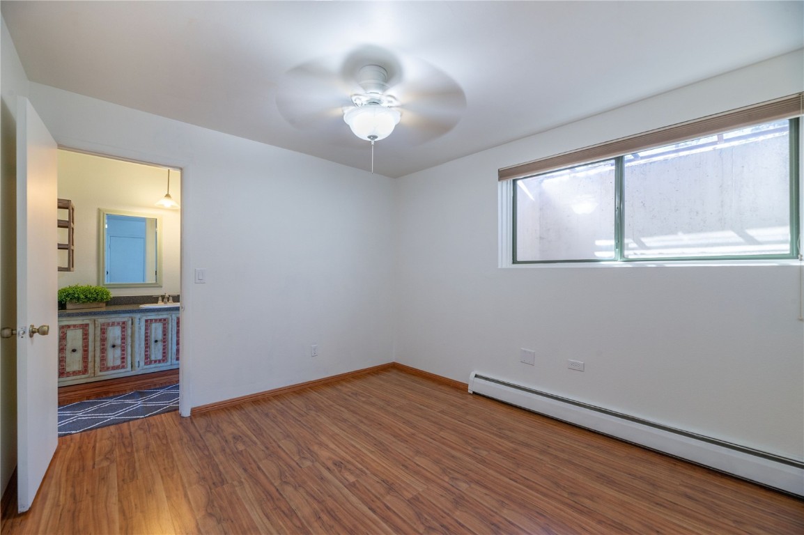 110 Evergreen Road, Unit 102 Dillon, CO 80435 - Photo 10 of 30 wooden floor in an empty room with a window