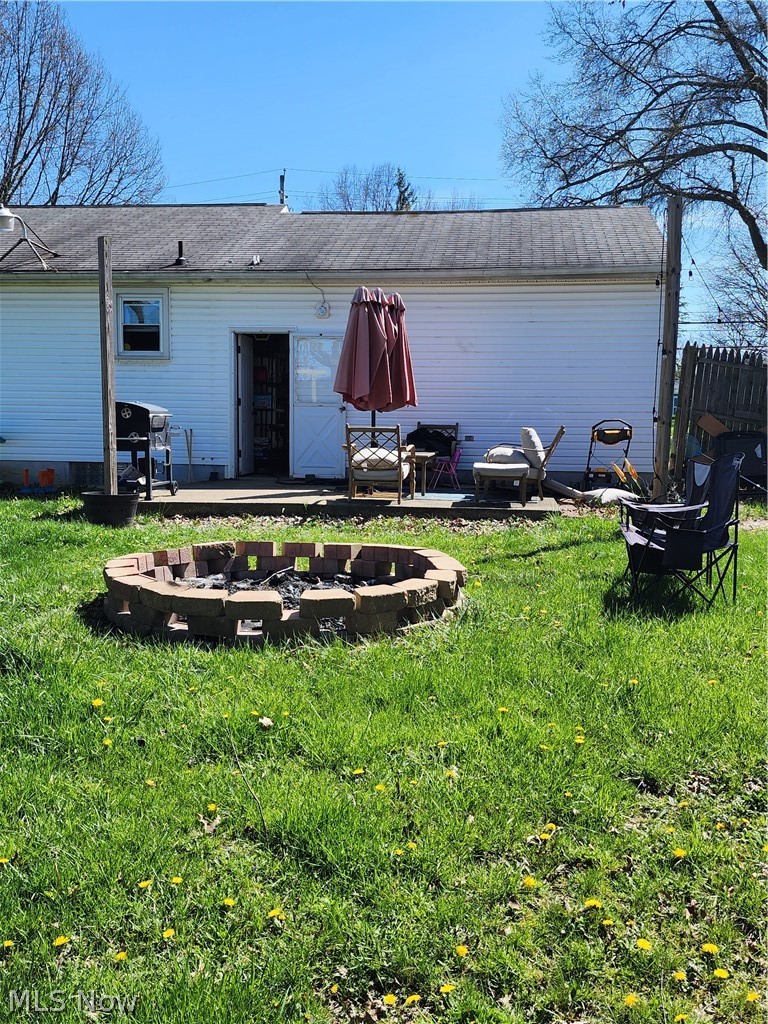 3860 Burkey Road Youngstown, OH 44515 - Photo 2 of 19 Rear view of house with a yard