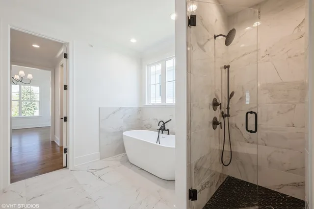 a bathroom with a bathtub and shower