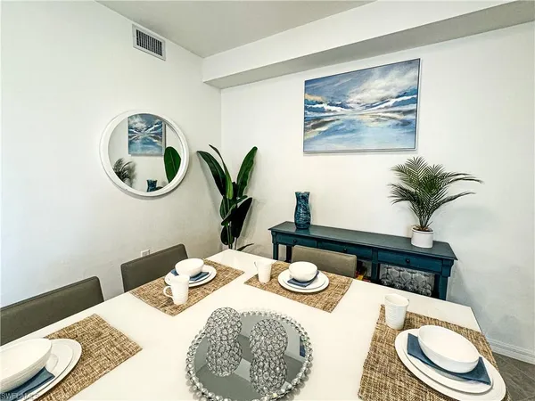 a table that has a sink and a chair in it