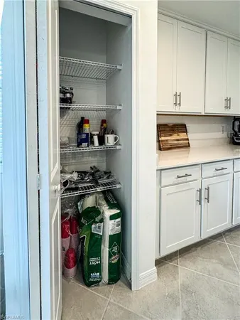 a kitchen with stove and cabinets