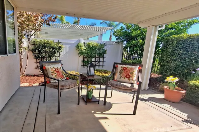 a view of a chairs and table in the patio