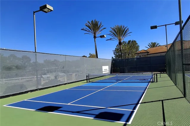 a view of an outdoor space and tennis court