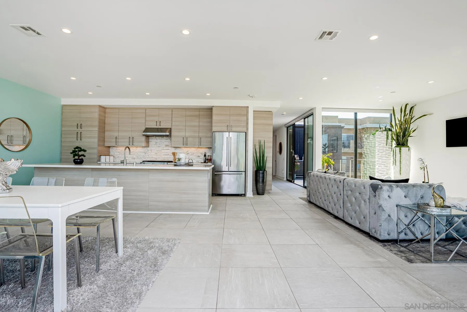 2359 Front Street San Diego, CA 92101 - Photo 11 of 50 a kitchen with kitchen island granite countertop counter top space a sink stainless steel appliances and cabinets