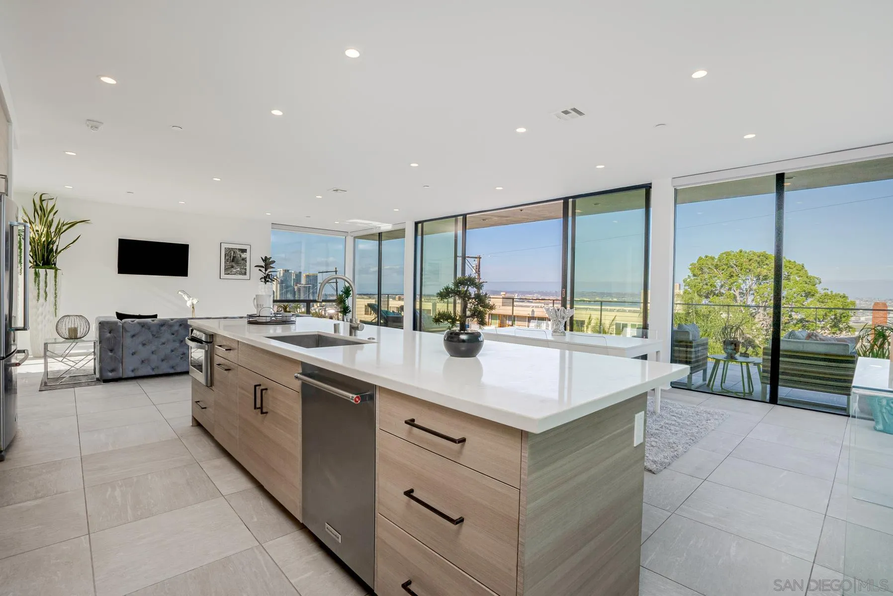 2359 Front Street San Diego, CA 92101 - Photo 12 of 50 a kitchen with stainless steel appliances kitchen island granite countertop a sink and a stove