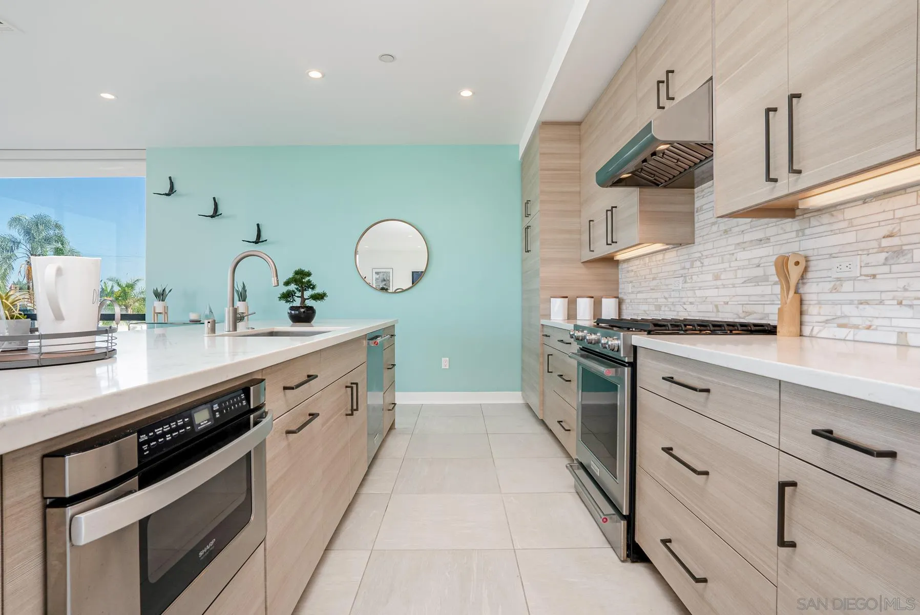 2359 Front Street San Diego, CA 92101 - Photo 14 of 50 a large kitchen with stainless steel appliances lots of counter space sink and cabinets
