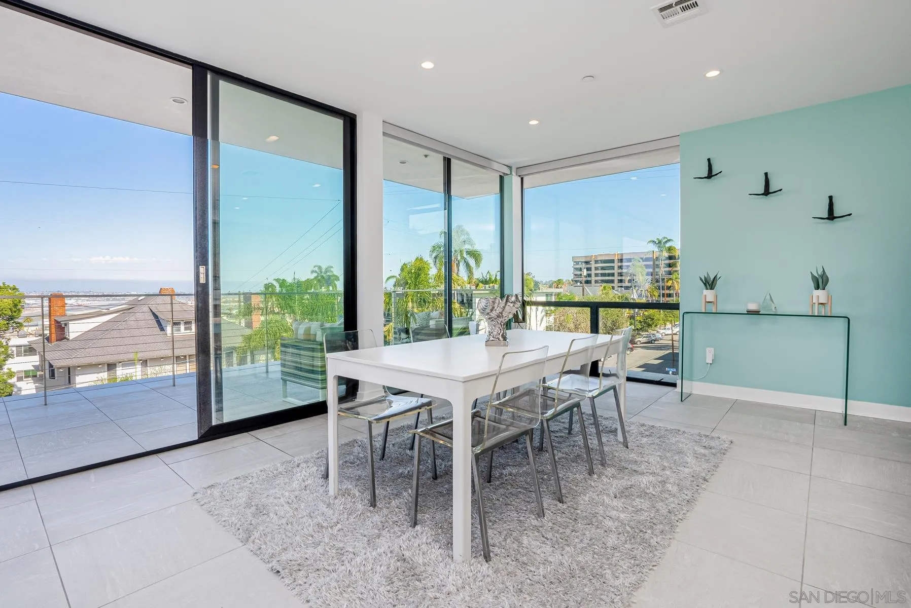 2359 Front Street San Diego, CA 92101 - Photo 20 of 50 a dining room with furniture and a floor to ceiling window
