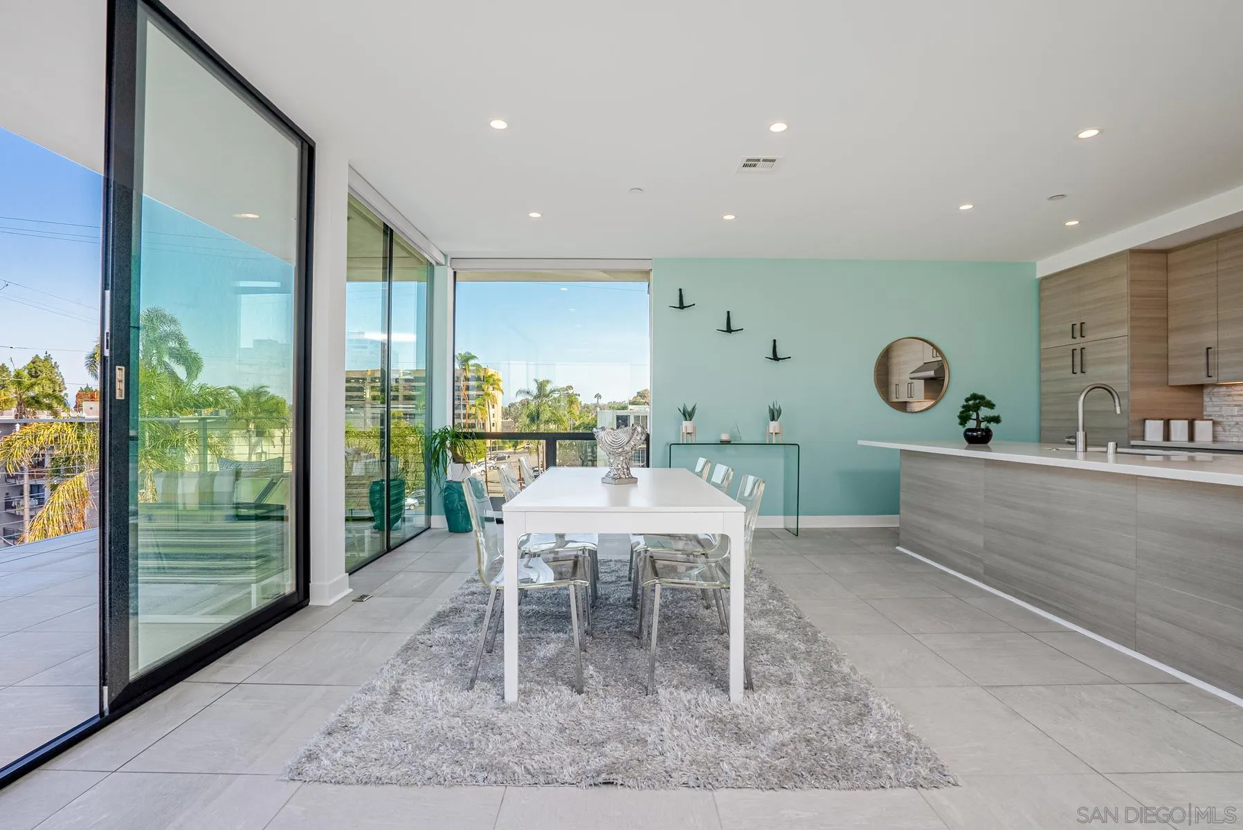 2359 Front Street San Diego, CA 92101 - Photo 21 of 50 a dining room with furniture and a floor to ceiling window