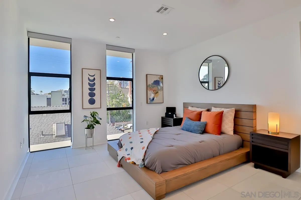 2359 Front Street San Diego, CA 92101 - Photo 31 of 50 a bed room with a bed and painting on the wall