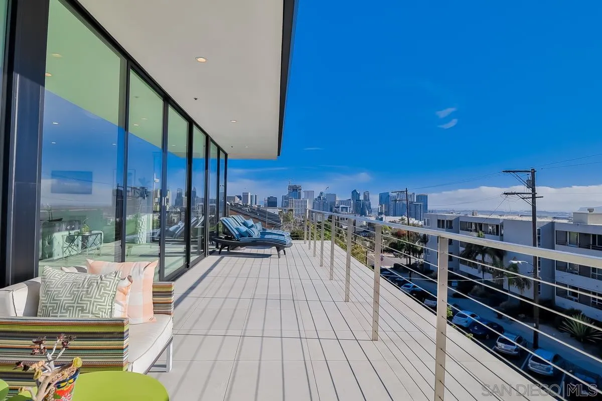 2359 Front Street San Diego, CA 92101 - Photo 6 of 50 a view of a balcony with wooden floor and potted plants