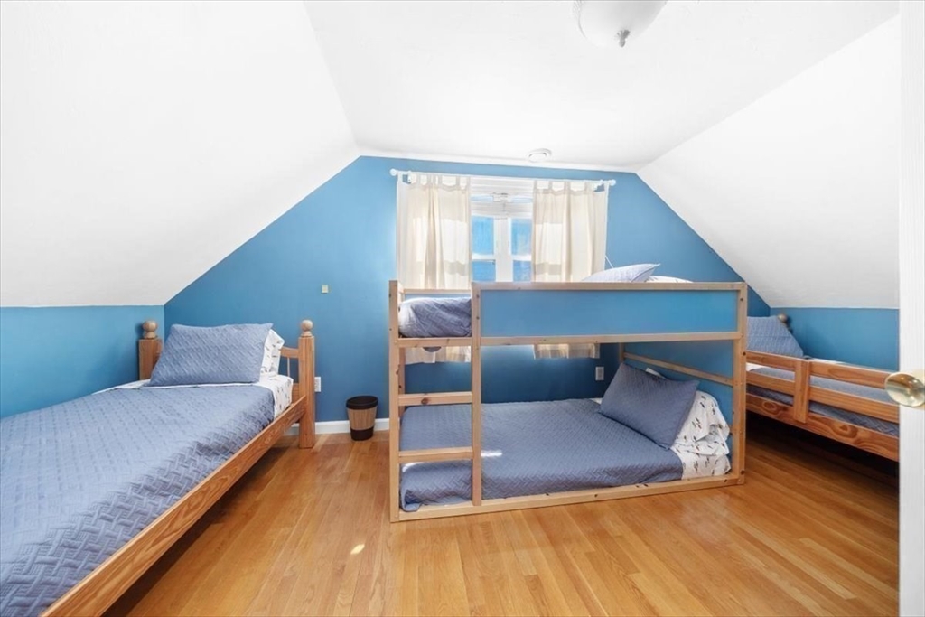 181 Atlantic Avenue Hull, MA 02045 - Photo 21 of 30 a living room with furniture and a wooden floor