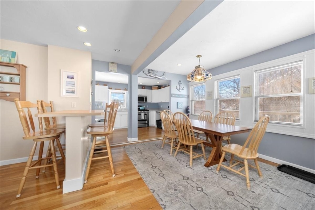 181 Atlantic Avenue Hull, MA 02045 - Photo 10 of 30 a view of a dining room with furniture window and wooden floor