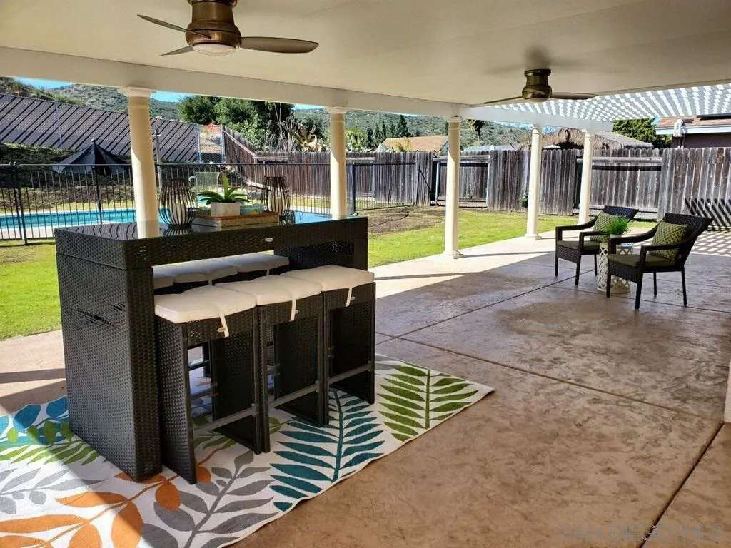 13130 Tobiasson Road Poway, CA 92064 - Photo 22 of 24 a view of a patio with a table and chairs