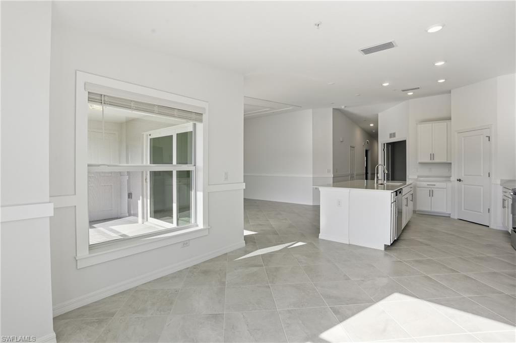 15185 Bluffton Lane, Unit 826 Punta Gorda, FL 33982 - Photo 21 of 50 a view of a kitchen with a sink and a large window