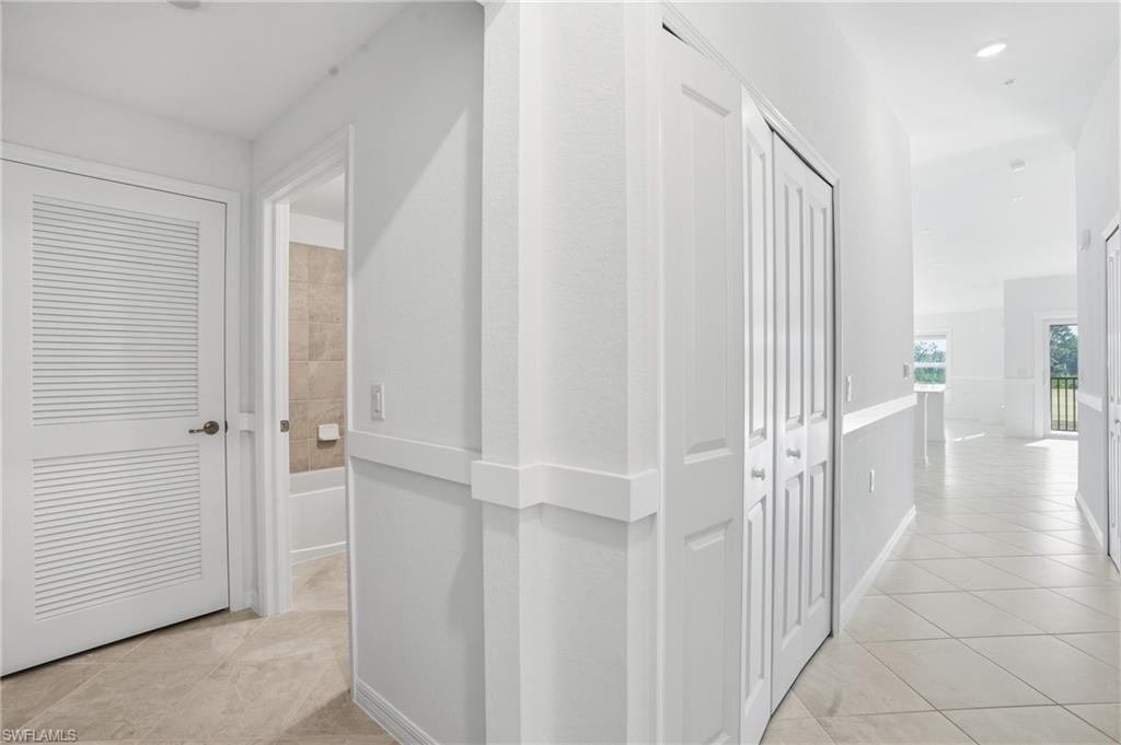 15185 Bluffton Lane, Unit 826 Punta Gorda, FL 33982 - Photo 26 of 50 a view of a hallway with a wooden floor