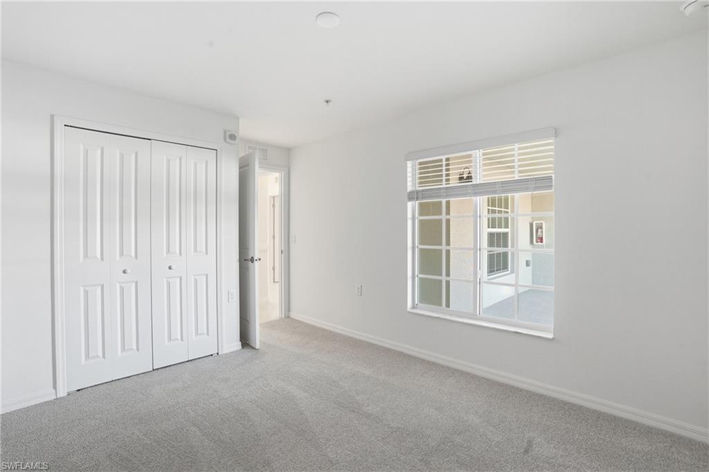 15185 Bluffton Lane, Unit 826 Punta Gorda, FL 33982 - Photo 28 of 50 an empty room with windows