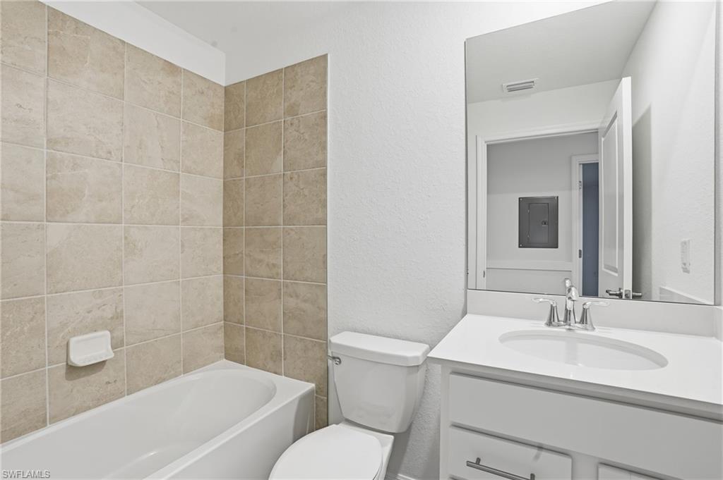 15185 Bluffton Lane, Unit 826 Punta Gorda, FL 33982 - Photo 29 of 50 a bathroom with a sink toilet and shower