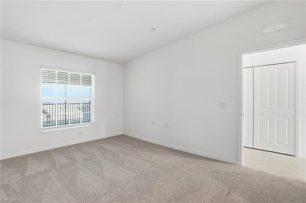 15185 Bluffton Lane, Unit 826 Punta Gorda, FL 33982 - Photo 32 of 50 an empty room with a window