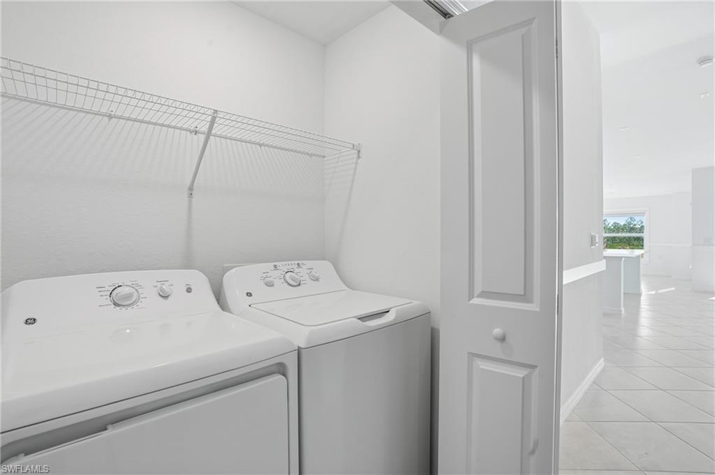 15185 Bluffton Lane, Unit 826 Punta Gorda, FL 33982 - Photo 35 of 50 a view of storage and utility room with washer and dryer