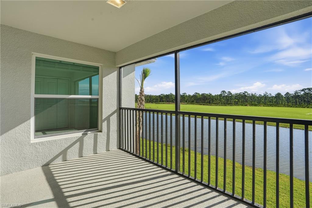 15185 Bluffton Lane, Unit 826 Punta Gorda, FL 33982 - Photo 39 of 50 a view of a balcony with wooden floor and outdoor space