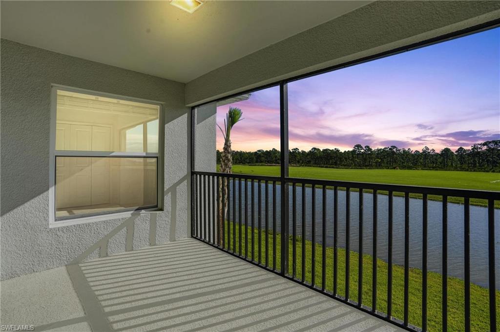 15185 Bluffton Lane, Unit 826 Punta Gorda, FL 33982 - Photo 40 of 50 a view of a balcony with wooden floor & fence