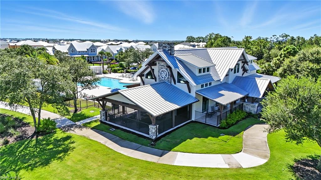 15185 Bluffton Lane, Unit 826 Punta Gorda, FL 33982 - Photo 47 of 50 an aerial view of a house with a big yard and potted plants