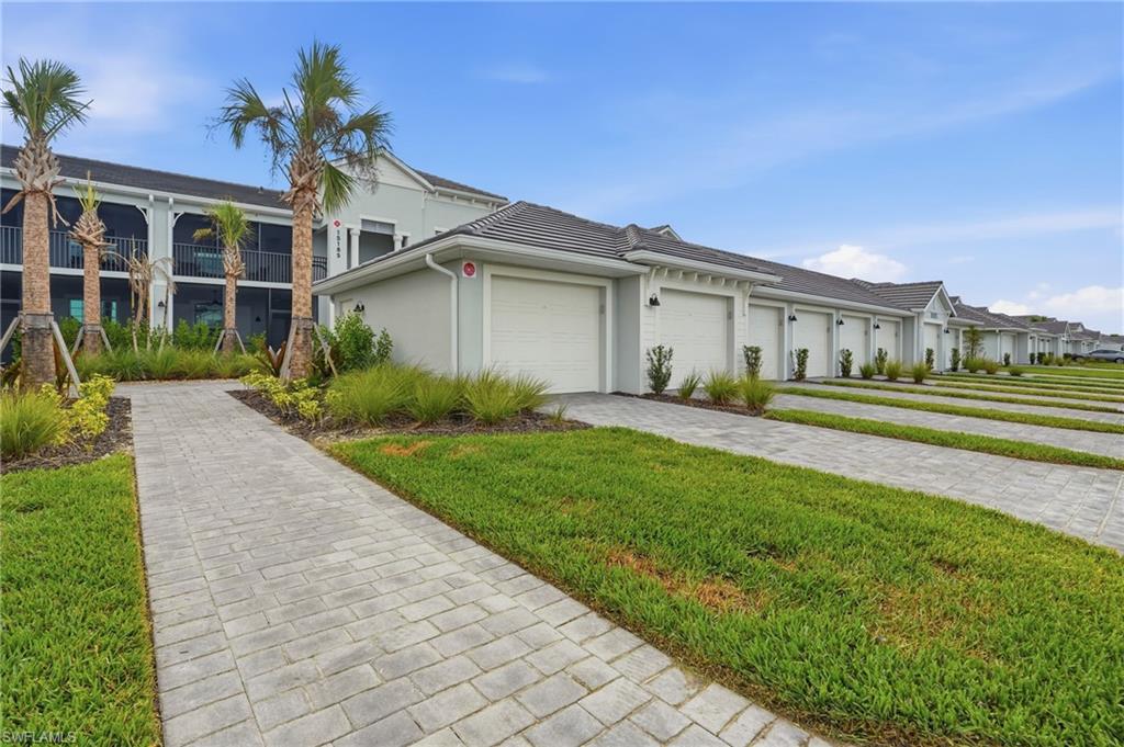 15185 Bluffton Lane, Unit 826 Punta Gorda, FL 33982 - Photo 5 of 50 a front view of a house with a yard