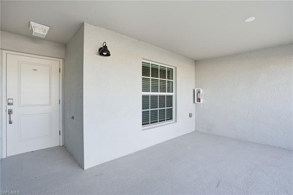 15185 Bluffton Lane, Unit 826 Punta Gorda, FL 33982 - Photo 10 of 50 an empty room with windows