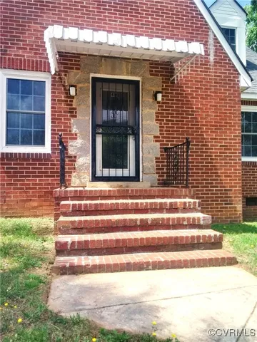 a view of entrance gate of a house