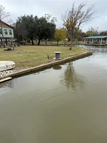 a view of a field with an trees